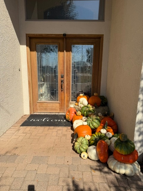 Gather Collection pumpkin styling at a white family porch