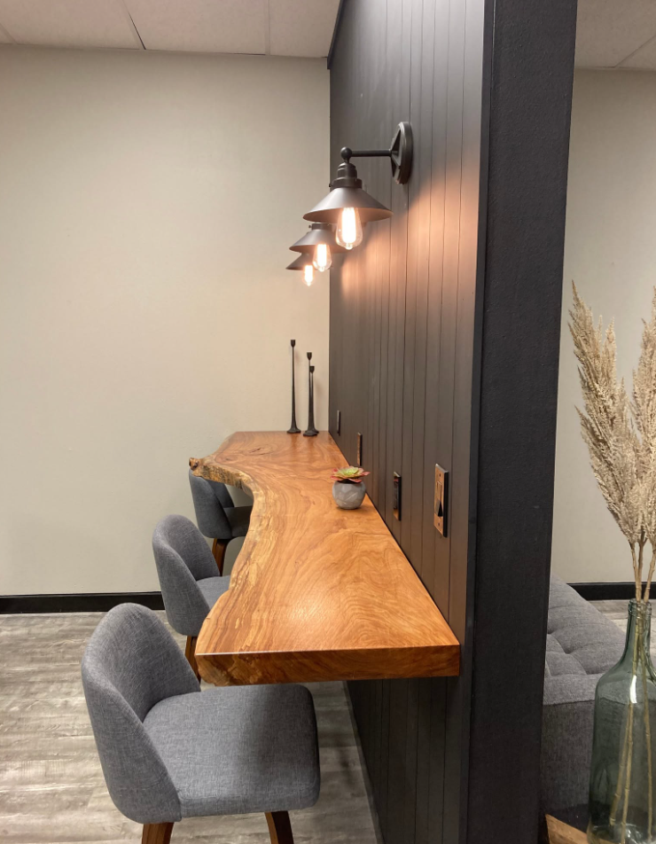 Hope Rock Project counter seating beneath wall sconces