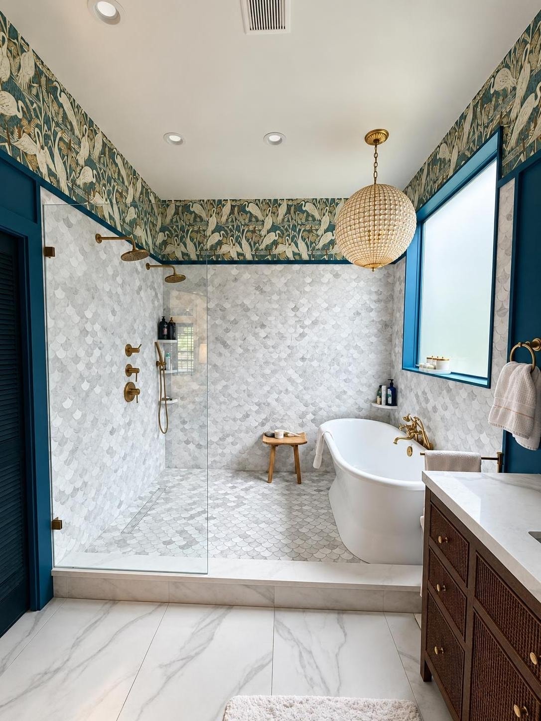 Modern bathroom with teal accents and marble tiles
