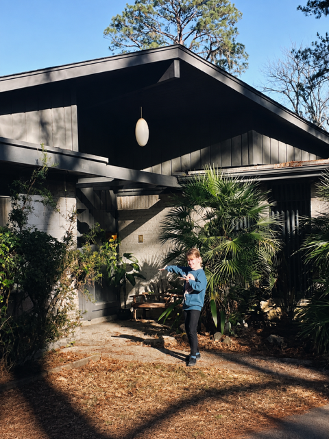 The founder of Born Again Home standing in front of her childhood home.